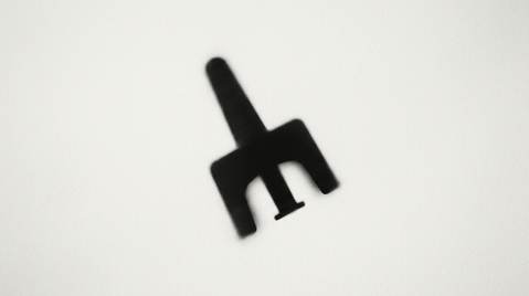 Monochrome tile for Harm next to hype